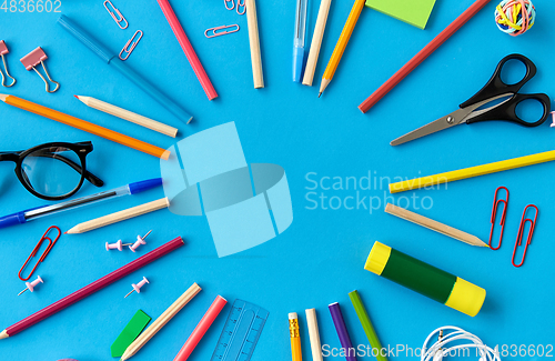 Image of stationery or school supplies on blue background