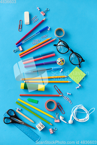 Image of stationery or school supplies on blue background