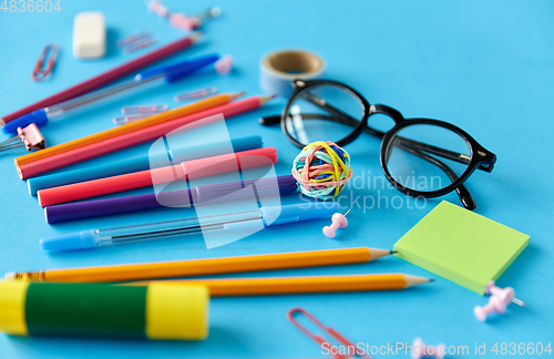 Image of stationery or school supplies on blue background