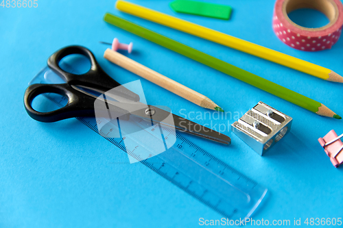 Image of stationery or school supplies on blue background