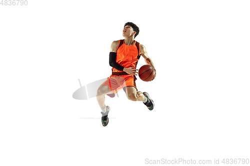 Image of Young basketball player training isolated on white studio background