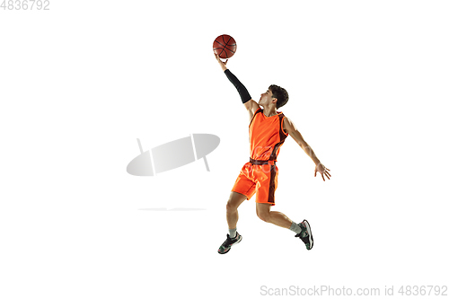 Image of Young basketball player training isolated on white studio background