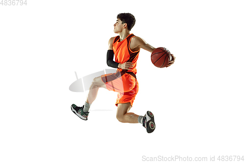 Image of Young basketball player training isolated on white studio background