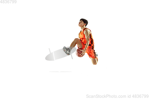 Image of Young basketball player training isolated on white studio background