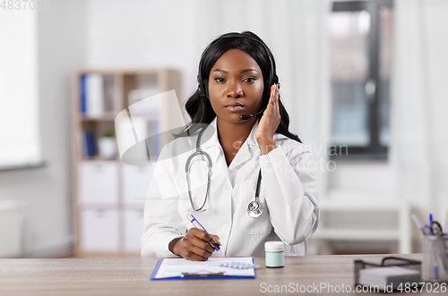 Image of african american doctor with headset at hospital