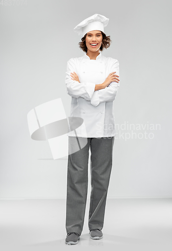 Image of smiling female chef in toque