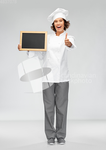 Image of happy chef with chalkboard showing thumbs up