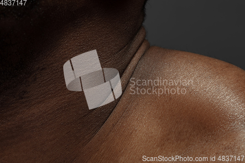 Image of Texture of human skin. Close up of african-american male body