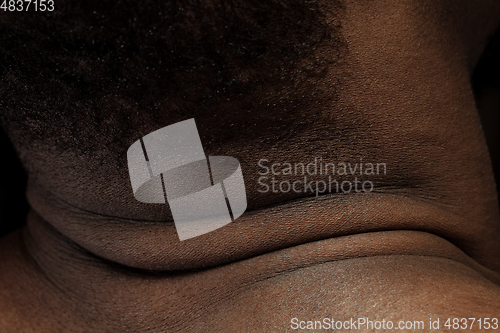 Image of Texture of human skin. Close up of african-american male body