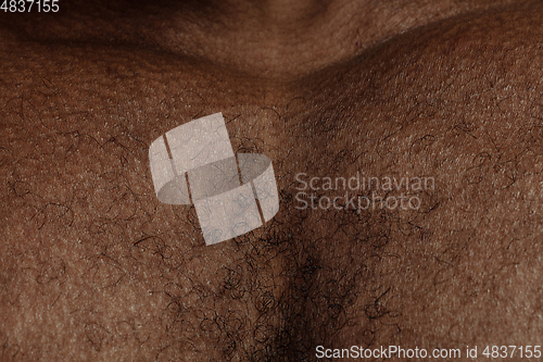 Image of Texture of human skin. Close up of african-american male body