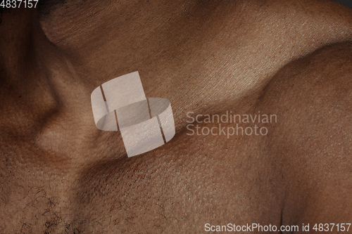Image of Texture of human skin. Close up of african-american male body