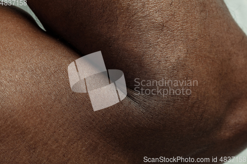 Image of Texture of human skin. Close up of african-american male body