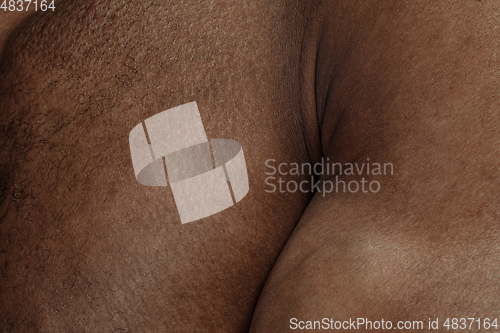 Image of Texture of human skin. Close up of african-american male body