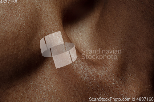 Image of Texture of human skin. Close up of african-american male body