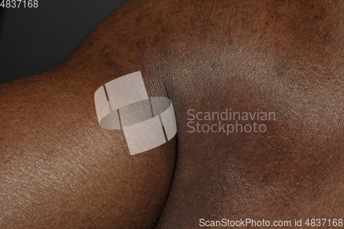 Image of Texture of human skin. Close up of african-american male body