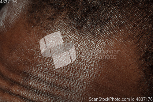 Image of Texture of human skin. Close up of african-american male body