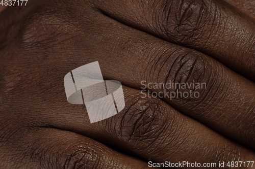 Image of Texture of human skin. Close up of african-american male body