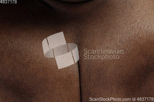 Image of Texture of human skin. Close up of african-american male body