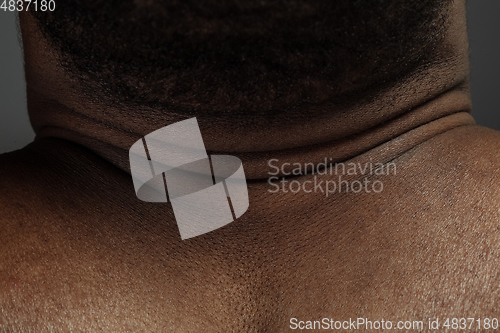 Image of Texture of human skin. Close up of african-american male body