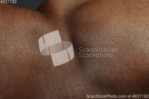 Image of Texture of human skin. Close up of african-american male body