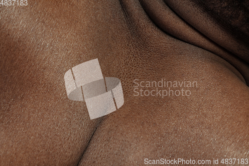 Image of Texture of human skin. Close up of african-american male body