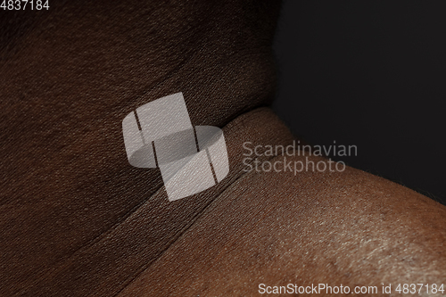 Image of Texture of human skin. Close up of african-american male body