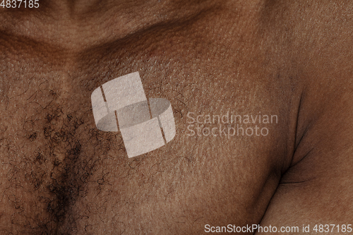 Image of Texture of human skin. Close up of african-american male body