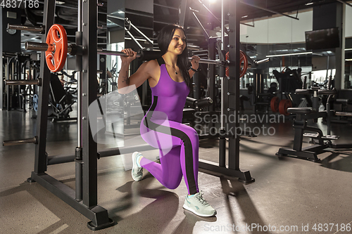 Image of The female athlete training hard in the gym. Fitness and healthy life concept.
