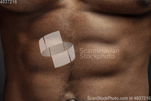 Image of Texture of human skin. Close up of african-american male body