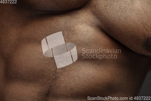 Image of Texture of human skin. Close up of african-american male body