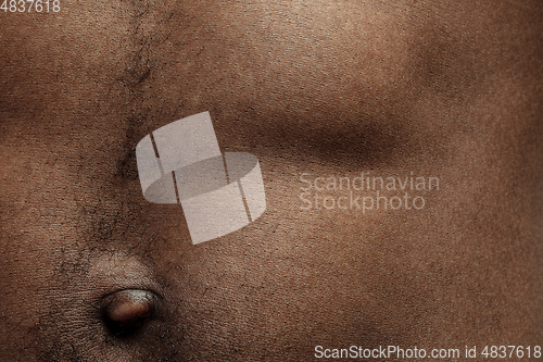 Image of Texture of human skin. Close up of african-american male body