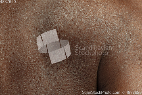 Image of Texture of human skin. Close up of african-american male body