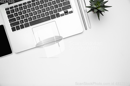 Image of Flat lay, mock-up. Feminine home office workspace, copyspace