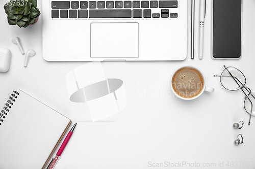 Image of Flat lay, mock-up. Feminine home office workspace, copyspace