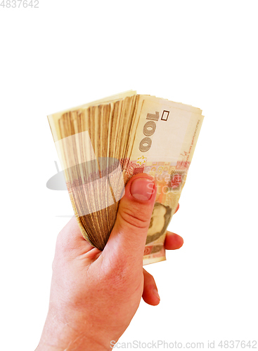 Image of Ukrainian money of value 100 in the hand isolated