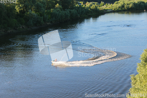 Image of couple of people in quadski going on the river