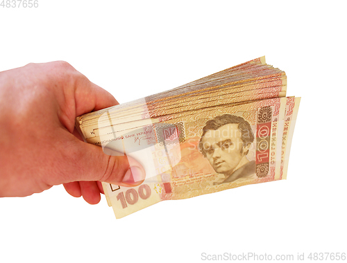 Image of Ukrainian money of value 100 in the hand isolated