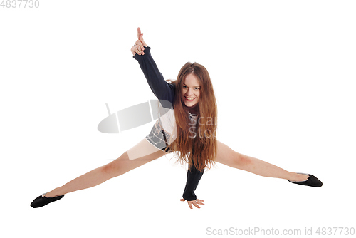 Image of Young happy woman crouching on the floor