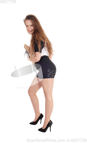 Image of Happy smiling woman standing in shorts