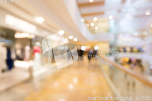 Image of Blurred image of people in shopping mall with bokeh