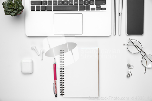 Image of Flat lay, mock-up. Feminine home office workspace, copyspace