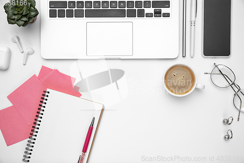 Image of Flat lay, mock-up. Feminine home office workspace, copyspace