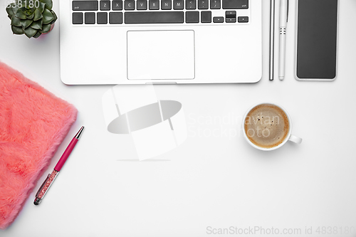 Image of Flat lay, mock-up. Feminine home office workspace, copyspace