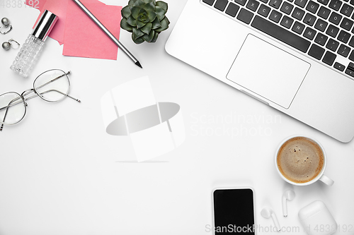 Image of Flat lay, mock-up. Feminine home office workspace, copyspace