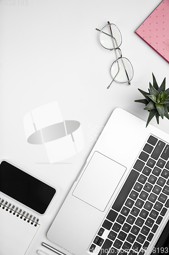 Image of Flat lay, mock-up. Feminine home office workspace, copyspace