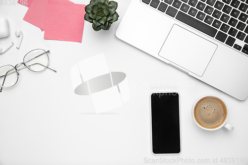 Image of Flat lay, mock-up. Feminine home office workspace, copyspace