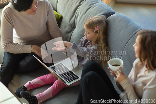 Image of Happy loving family. Grandmother, mother and daughter spending time together