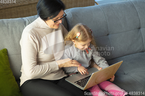 Image of Happy loving family. Grandmother and grandchild spending time together