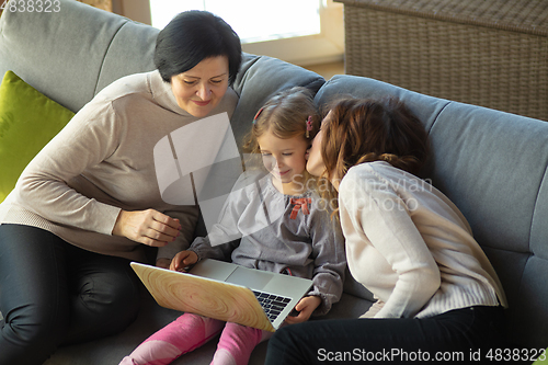 Image of Happy loving family. Grandmother, mother and daughter spending time together