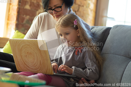 Image of Happy loving family. Grandmother and grandchild spending time together